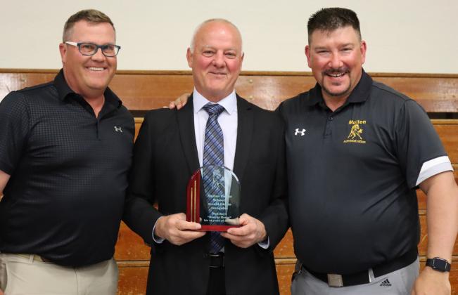 MHS Principal Mike Kvanvig (left) and MPS Superintendant Chris Kuncl (right) honoring retiring Activities Director Phil Hoyt.