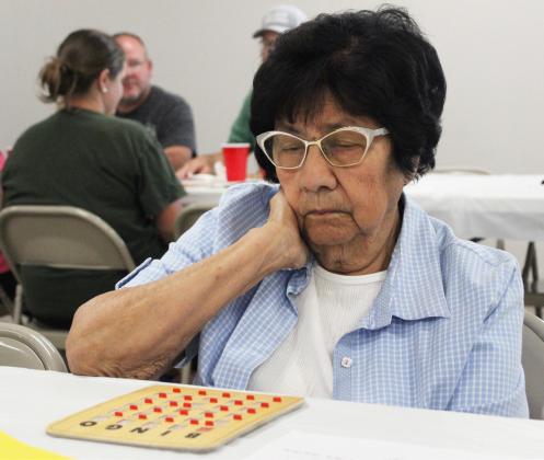 Gerri Peterson Mary Lou Isom keeps an eye on her Bingo card last Wednesday.