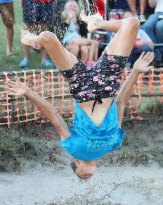Bo Pettit, Jr. celebrates his team’s victory with a back flip.