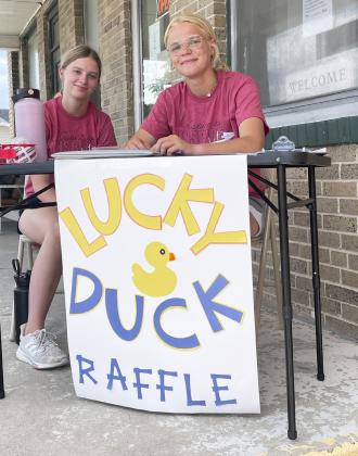 Erika Massey (left) and Tierston Moore selling ducks during alumni weekend last month.