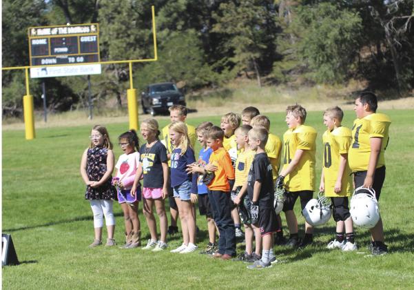 Some of the Mullen second and third graders sang the national anthem at the start of the Mullen youth football game against South Loup on Sunday, Sept. 25 with music teacher Caroline Durfee’s direction. Pictured front, l-r: Taylor Cash, Natalee Walker, Emri Dent, Elle Gracey, Tuff Pettit, Jaxyn Evans, Luke Cox, Ryden Ourada. Back: Caleb Deibler, Gus Wingebach, Cylas Dent, Kyler Marsh, Jackson Newman, Duke Miller, Hunter Gray. Gerri Peterson