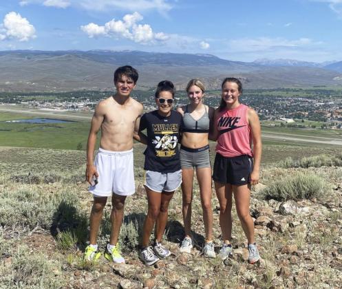 The team after their seven mile run that included running up W Mountain. Pictured l-r: Trevor Kuncl, Coach Janie Kuncl, Peyton Paxton, Callie Coble. courtesy photos