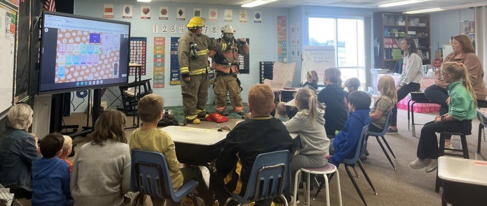 Mullen Volunteer Fire Department’s Jason Brown and Chris Wurm visited Mullen Elementary last Monday, Oct. 6 to talk about fire safety. Students got a fire truck tour and were able to try on gear. courtesy photo