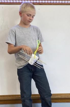Second graders build bird feeders