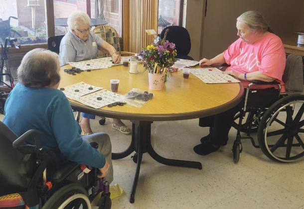 L-r: Peggy Barnt, Nadene Andersen and Ann Connell playing Bingo.