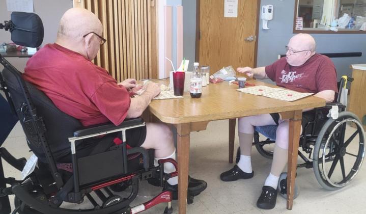 Stan Boyer (left) and Bob Osterman playing Bingo.