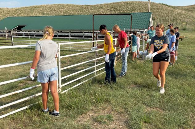 Hooker County 4-H members cleaned out the hog barn, picked up trash around the fairgrounds and painted the show ring last Tuesday, July 21 to prepare for fair this week. Gerri Peterson