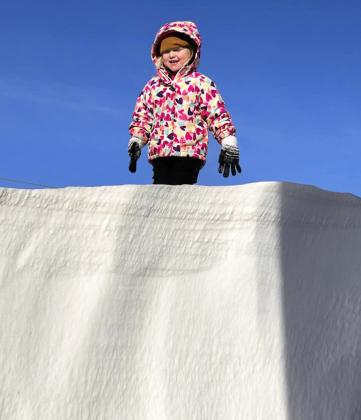 Grandma Mendy Stichka estimates this drift her granddaughter Violet Stichka is standing on is 8-10 feet tall at Big Creek Ranch!