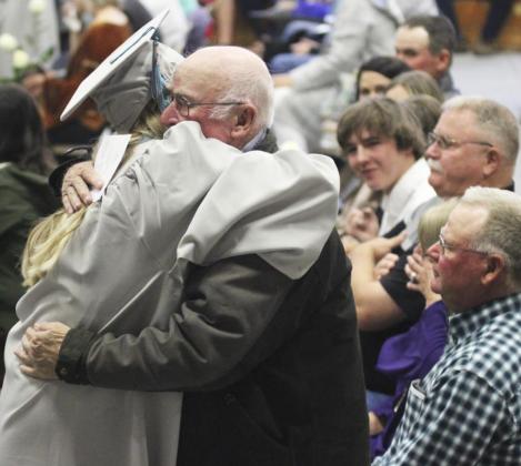 Last but not least in her row of family members, Hanna Marshall presented her great-grandpa, Dean Marshall a rose last Saturday. Gerri Peterson