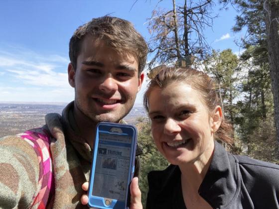 Samuel and Jill Coble display the Tribune after climbing the Manitou Incline in Colorado Springs last April.