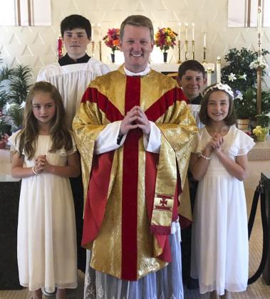 Lillian Ericksen, daughter of Marc and Alicia Ericksen, and Avery Vinton, daughter of Kevin and Callie Vinton, celebrated their First Communion during Mass at St Mary’s, Mullen, on April 16 with Father Matthew Nash presiding. A noon luncheon followed the celebration for the parishioners and guests in honor of the communicants. Pictured front l-r: Avery Vinton, Father Matthew Nash, Lillian Ericksen. Back: Altar servers Cian and Colin Connealy. Marc Ericksen