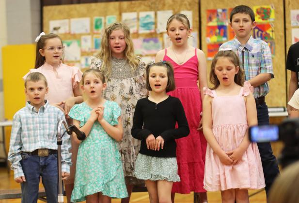 Back, l-r: 3rd graders Anna Hessin, Marki Finney, Sadie Hoyt and Marcus Lattin. Front, l-r: 2nd graders Trent Cox, Eve Ericksen, Ellie Licking and Aislynn Connealy during the Spring Music Concert last Tuesday, April 8. Gerri Peterson