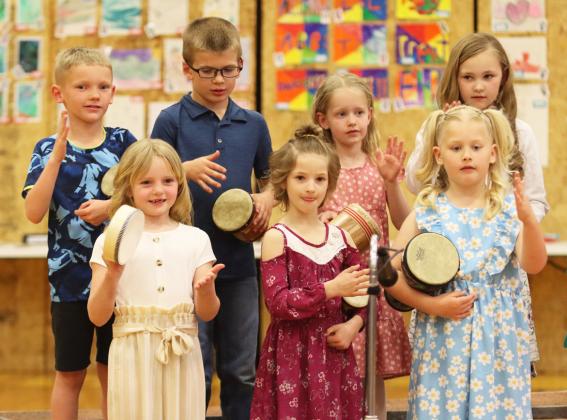Back, l-r: 1st graders Jaxson Barnes, Cooper Ourada, Aurora Polt and Brogan Jewell. Front: kindergartners Ryann Walz, Rhyme Pettit and Harper Myers performing “Percussion Relay.”