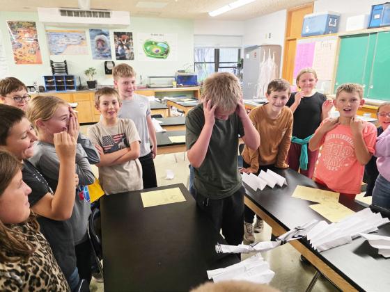 STEM Club met last Tuesday, Oct. 14 to think like engineers and worked on designing the strongest bridge. There were lots of great designs! Pictured is Caleb Deibler reacting as his design was tested. courtesy photo