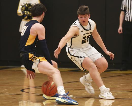 Deacon DeNaeyer on defense against Paxton in the subdistrict final game on Feb. 23. Megan Andersen
