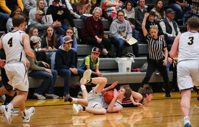 Brandon Hardin motions for a time out from the floor against Sandhills Valley on Feb. 8.