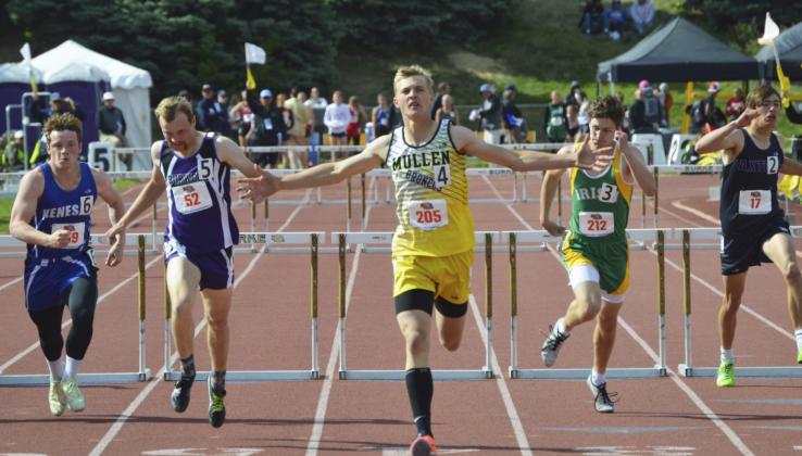 Clayton Moore celebrates his victory in the Class D boys 300 meter hurdles last Saturday. Alex Moore
