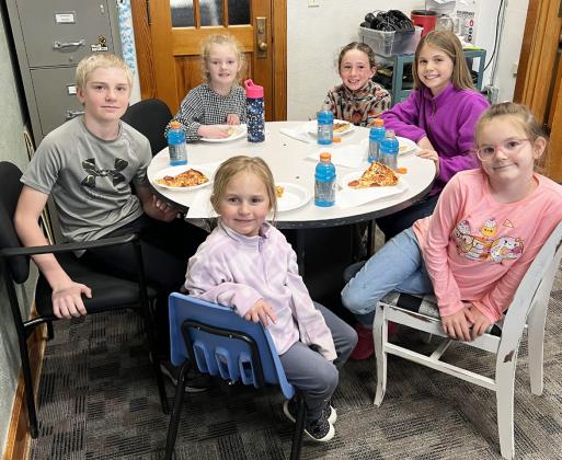 Pictured clockwise around the table from the left: Jedd Kraus, Anna Ridenour, Dailie Dent, Abbigail Mundorf, Anna Hessin, Doris Boland. Brett Mauler