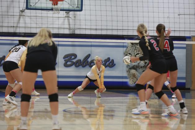 Tierston Moore with a dig last Tuesday at the triangular in Arnold. Megan Andersen