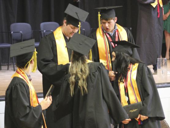 As the rest of their classmates continued to be presented with their diplomas, Jeffery Forsen, Whitney Jennings, Deacon De-Naeyer and Izabella Brown all wanted to know if Tel Kvanvig’s diploma was signed or not! Gerri Peterson