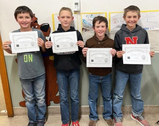 The 4th graders did a “Holiday Tech Puzzle Choice Board” in library class last Wednesday, Dec. 17 and the “Grinch Hour of Code” was one of the options. These four students (pictured l-r: Marcus Lattin, Eli Barnes, Holt Morrison and Grady Phipps) completed all 20 levels of creating a basic block code featuring the Grinch and other characters from the new animated Grinch movie. Each level had a different challenge for them to complete by creating the code for the task. Emily Stichka