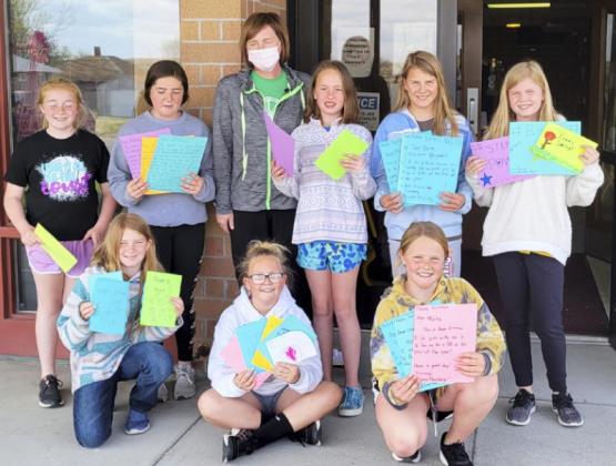 Girls on the Run delivering their Community Impact Project to Pioneer Memorial Rest Home’s Activity Director, Gini Corbin.