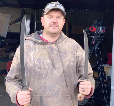 Chris O’Brien with the ginunting swords he made at his home forge in the third and final round of Forged in Fire. courtesy photo