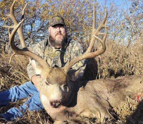 T.J. Harding with his mule deer taken in Saskatchewan