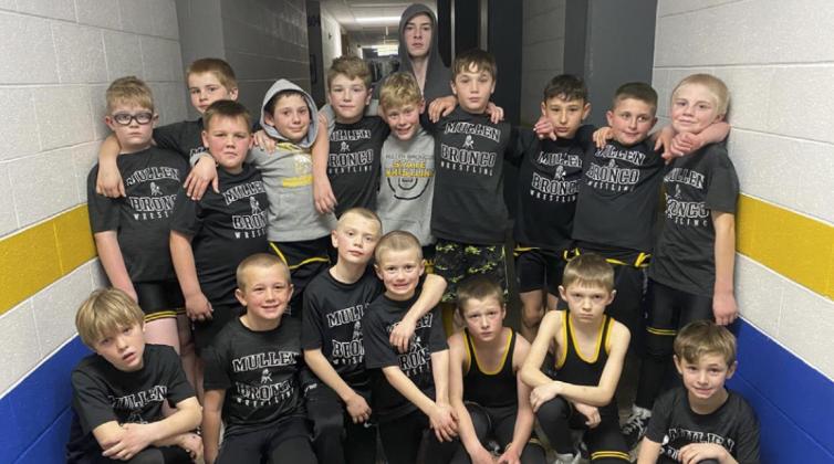 Mullen youth wrestlers competing at the West Holt Duals are pictured back, l-r: Collin Donohoe, Justin Kraus, Carson Hegland, Colin Connealy, Colby Kessler, Cody Walker, Jason Kraus, Bo Pettit, Jr., Gunner Brown, Bronx Burney, Jedd Kraus. Front: Gus Wingebach, Caleb Deibler, Weston Ourada, Ryden Ourada, Cylas Dent, Kyler Marsh, Tuff Pettit. Steven Dent