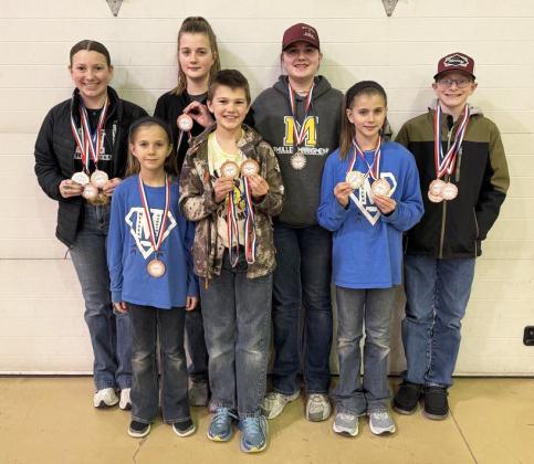 Mullen Marksmen medaling at Mitchell are pictured back, l-r: Hope Miller, Adelyn O’Brien, Jessa O’Brien, Oakes Miller. Front: Aleah O’Brien, Ransom O’Brien, Rainne O’Brien. Not pictured: Zach Hicks. Tami Miller