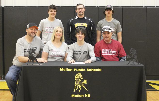 MHS senior Jeffery Forsen signed his letter of intent to wrestle for Chadron State College last Friday, April 21. He is seated with his parents, Jeff and Kris Forsen, and his grandpa, Taylor Marshall. Standing, l-r: Jaylon Forsen, MHS wrestling coach Bo Pettit and Jarren Forsen.