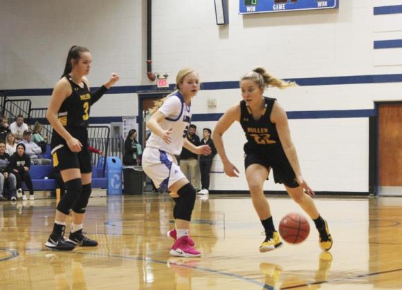 Taylor Svoboda dribbles around a defender at Hyannis while Shelby Welsh prepares to set a screen. Alex Moore