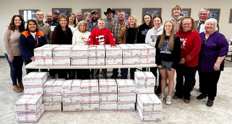 Mullen residents will recognize a couple familiar faces on the right hand side of this photo - Pastors Bill and Shanon Williams who helped pack this shipment of Big Red Battlefield Boxes. courtesy photo