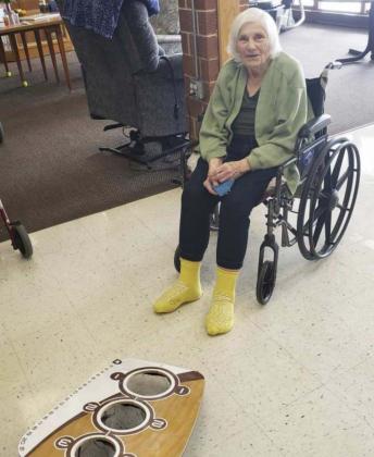 Pictured are our Halloween decorations and Marlene Dykes playing bean bag toss.