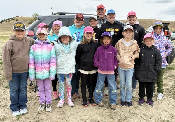 Girl Scout Day Camp participants, back, l-r: Anna Hessin (peeking), Daryl Deibler, Ella Walz, Danielle Peterson, Maci Walz, Ava Walz, Aislynn Connealy. Front: Harper Myers, Rhyme Pettit, Ryann Walz, Kinley Crisp, Addison Mundorf, Brystol Call, Violet Stichka. Bill Williams standing tall in the back! And, yes, it was a little chilly but the girls learned to dress in layers. Sooky Marks