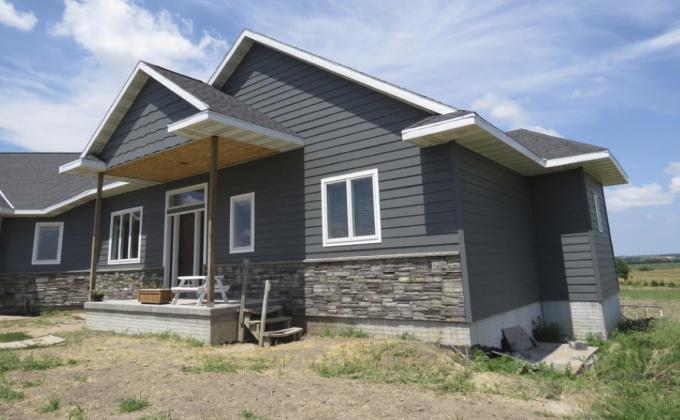 The house is going up slowly because Rylan and Kayla Little are paying as they go and working on the place on weekends and holidays. Their hard work and patience have left them mortgage-free.