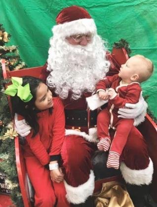 Rod &amp; Yvonne Andrews’ grandchildren Hayes (1) and Hadley Ellwanger (6) visiting Santa last year.