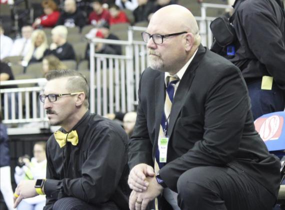 Assistant Coach Bo Pettit (left) and Head Coach Russ Monette intently watch one of their matches at State Wrestling. Kris Forsen