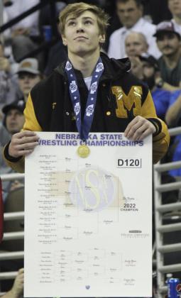 Eli Paxton on the medal stand as the Class D 120 State Champ.