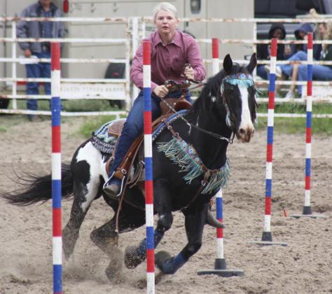 Faith Miller runs poles at Thedford. Tami Miller