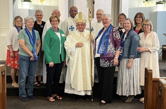 Back, l-r: Julie Gehrig, Sharon Swett, Father Lou Nollette, Father Vijumon, Father Dave Rykwalter, Deb Kearns, Marylin Ericksen. Front: Cheryl Perkins, Sandy Eggert, Bishop Hannefelt, Darleen Schulte, Judy Schwartz, Loretta Hamilton. courtesy photo