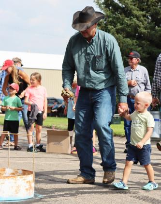 Tim Rice and grandson William Spurlin take their turtle to the race ring. Left: Overall champion Hayley Donohoe. Gerri Peterson