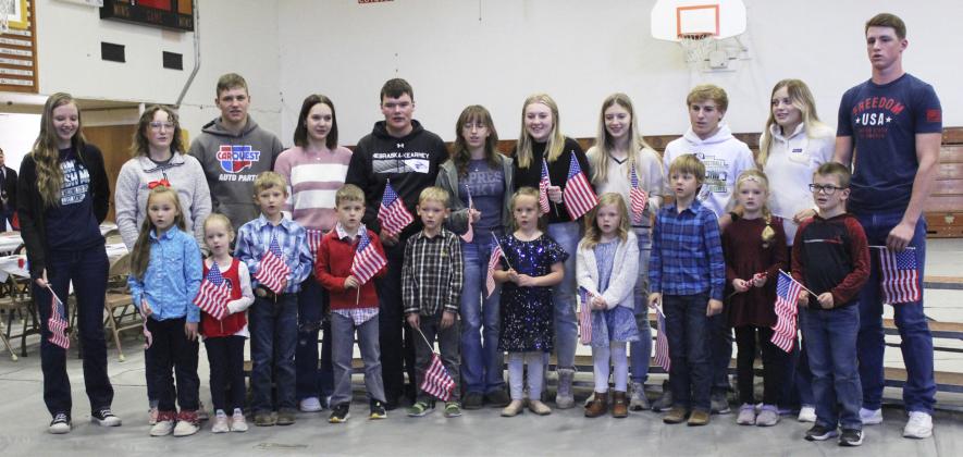 The tradition of the Mullen seniors singing with the kindergartners at the Veterans Day program continues! Pictured back, l-r: Kierstin Pike, Corynn Corbin, James Kessler, Ashlyn Simonson, Owen Thorberg, Malia Oltmer, Samantha Cheever, Erika Massey, Kyle Finney, Lauren Schoonveld, Chase Gracey. Front: Brogan Jewell, Aurora Polt, Merick Lattin, Tate Phillips, Jaxson Barnes, Kinley Crisp, Meyer Vinton, Kayden Evans, Anna Ridenour, Cooper Ourada. Gerri Peterson