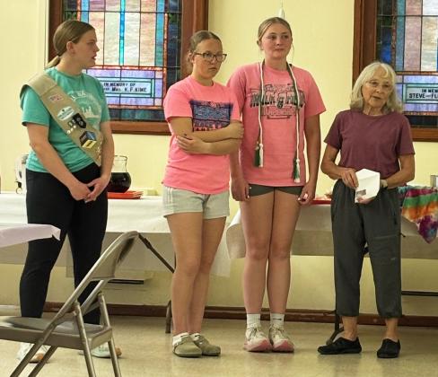 Senior and Ambassador Girl Scouts, l-r: Maci Walz, Riley Hegland, Hayley Donohoe, leader Sooky Marks.