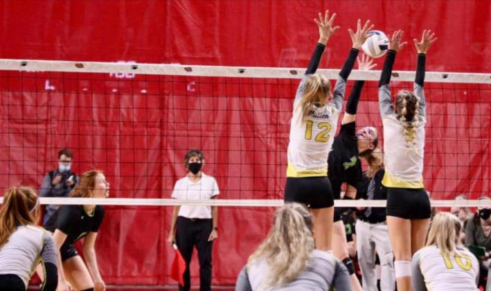 Brooke McCully and Alli Loughran go up for a double block at State. Sue Licking