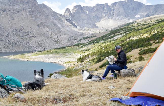 First newspaper to be read at Tayo Lake? We’re not sure, but it’s for sure the first time a copy of the Hooker County Tribune’s Vacationer Issue has been there! Photo by Colby Osborn of his wife Amanda and their dogs Dakota and Mica soaking in the views of the Wind River Range in Wyoming.
