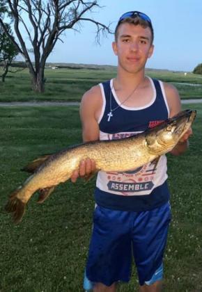 Brendon Walker with a Sandhills northern pike.