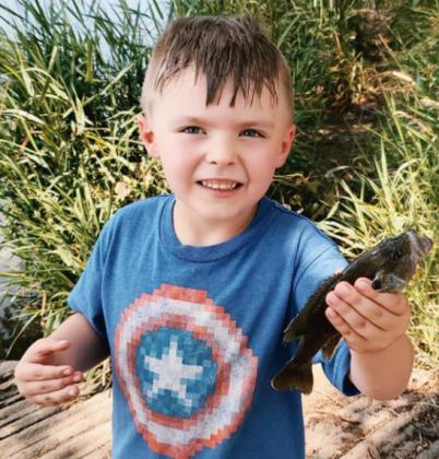 Tiffany Hardy Zlomke of Dodge, Nebraska, sent this photo of her son Braxton. She said he would kiss the fish and throw them back in.