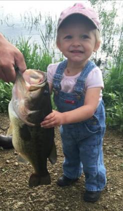 Kelly Froning, Jan Furrow’s great-granddaughter, from Cody, Nebraska, holding her dad Richard’s fish at the refuge.