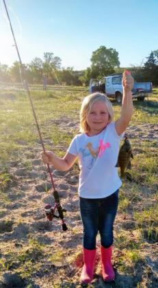 4-year-old Tatum Deibler with her first fish of the summer.
